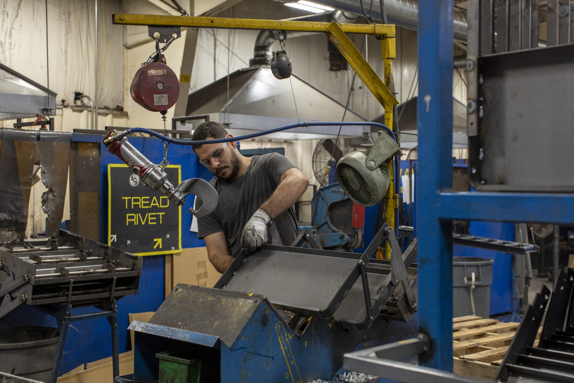  Worker Testing a Trailer Chassis During Research and Development